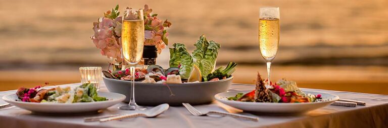 outdoor sunset dinner next to ocean